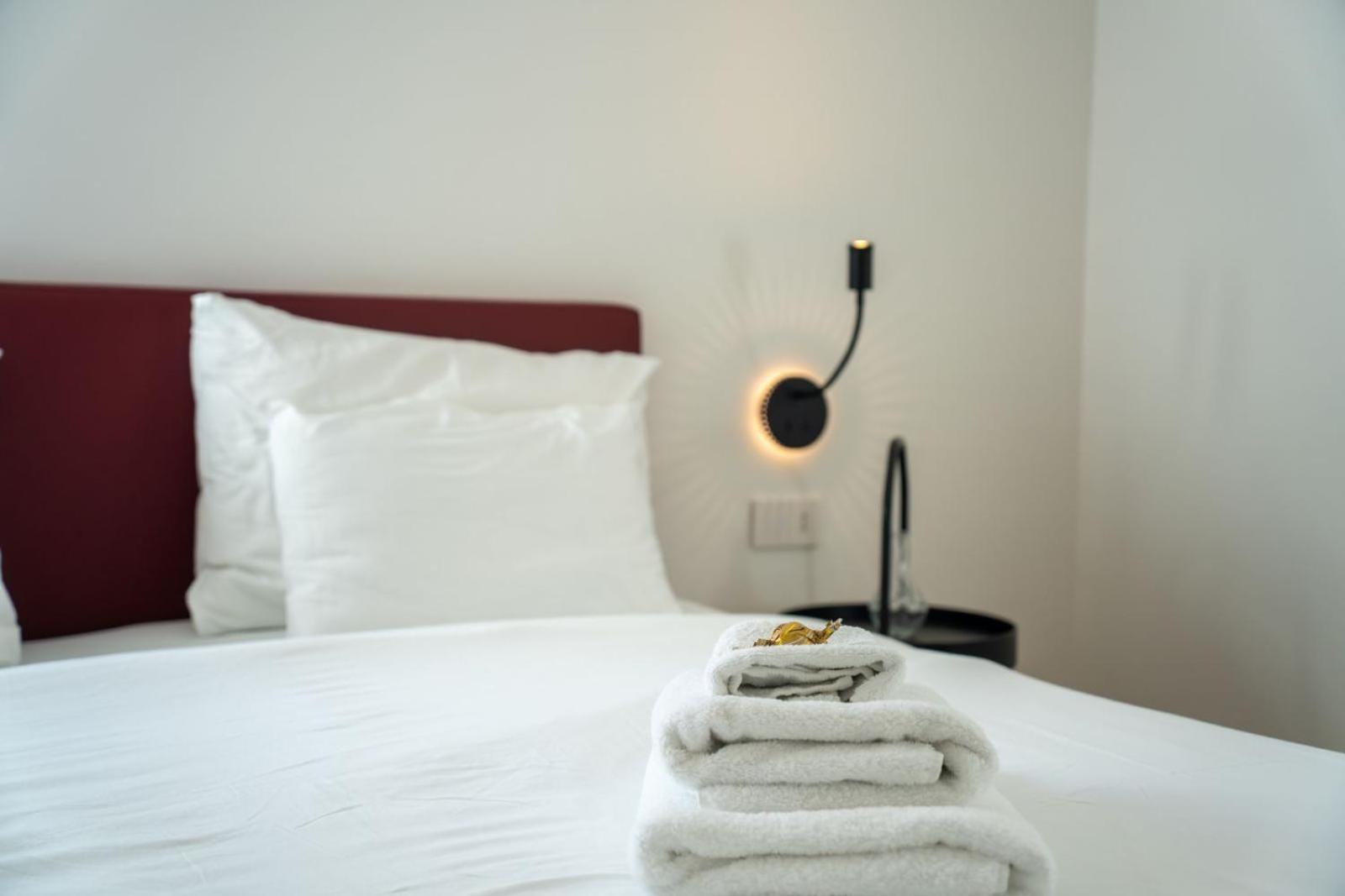 Guesthouse Diwine Merano Exteriér fotografie A bed with towels